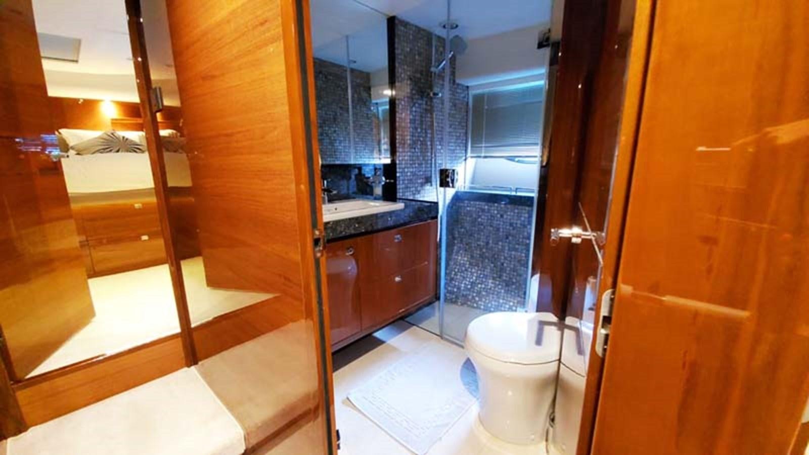 a bathroom with a glass shower aboard AQUA CHAMELEON Yacht for Sale