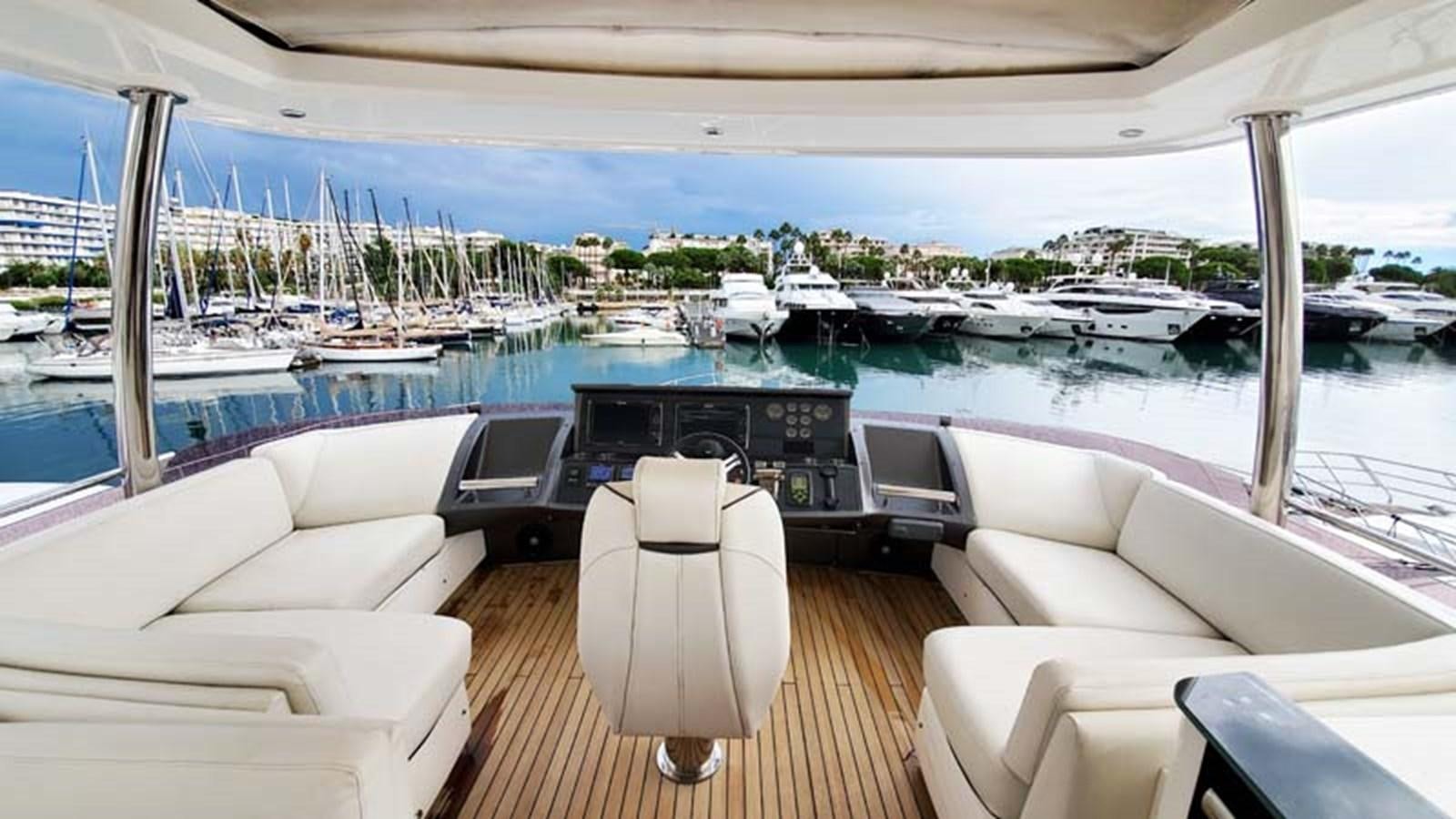 a room with a view of the water and boats aboard AQUA CHAMELEON Yacht for Sale