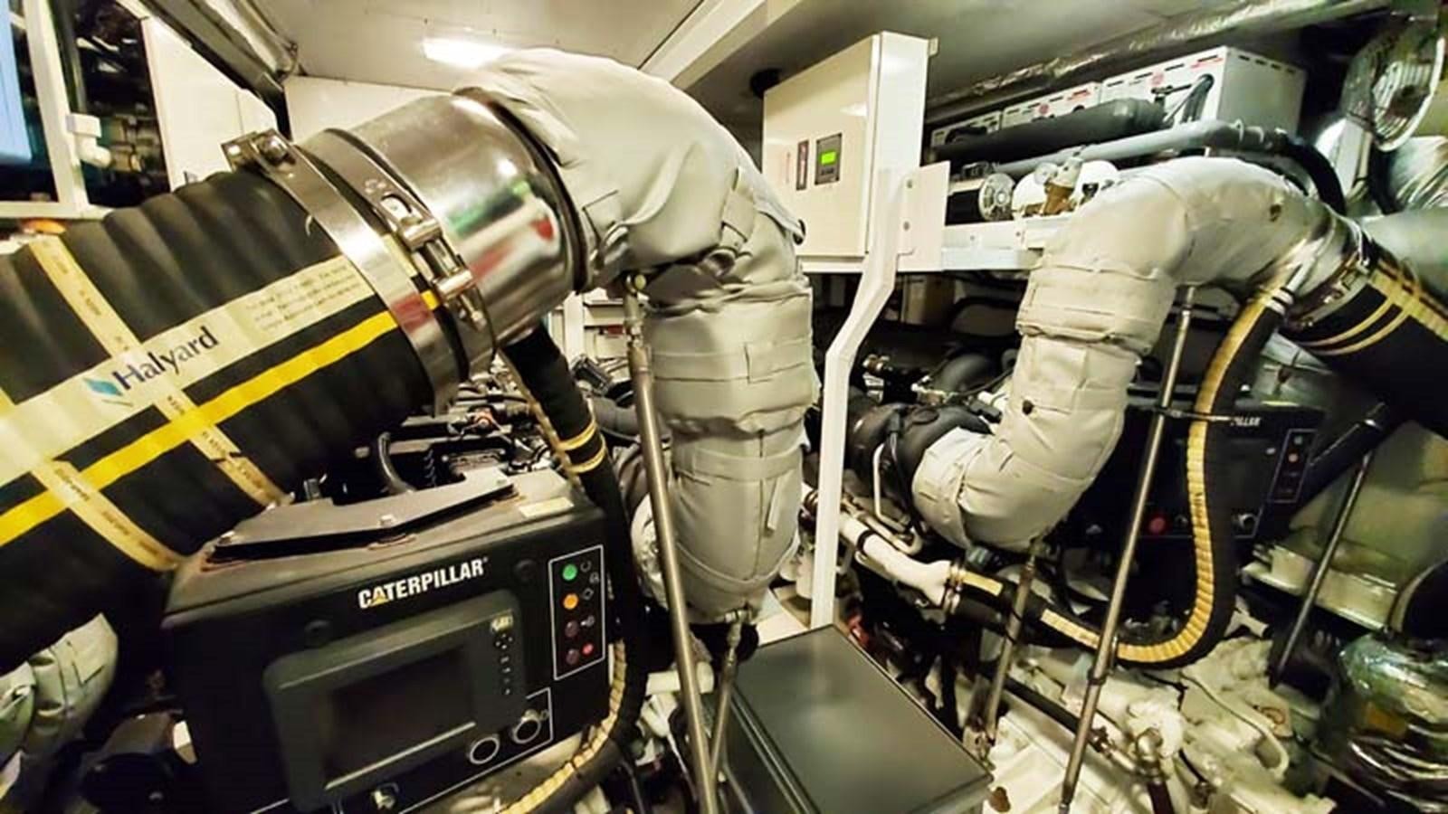 a person in a white suit and boots in a vehicle aboard AQUA CHAMELEON Yacht for Sale