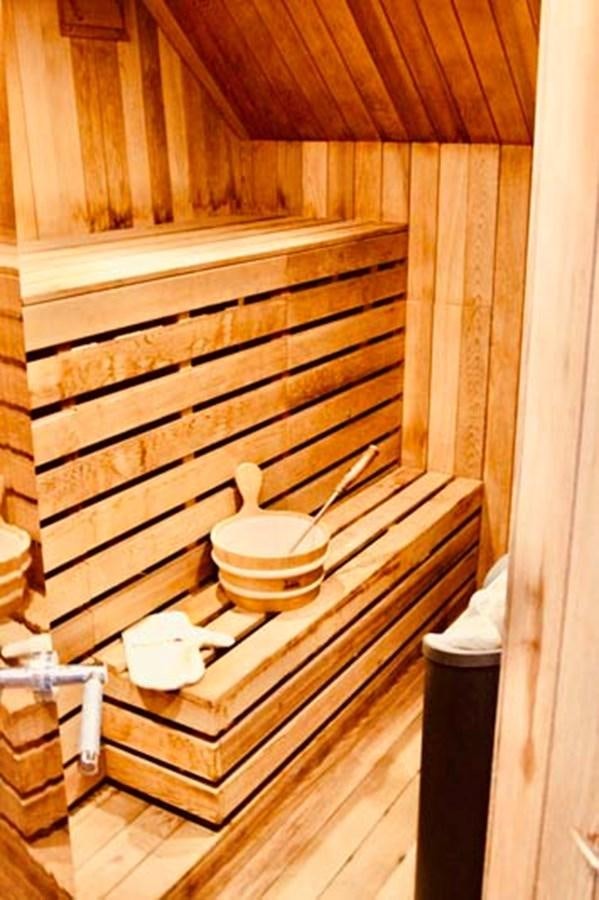 a toilet in a wooden room aboard AQUA CHAMELEON Yacht for Sale