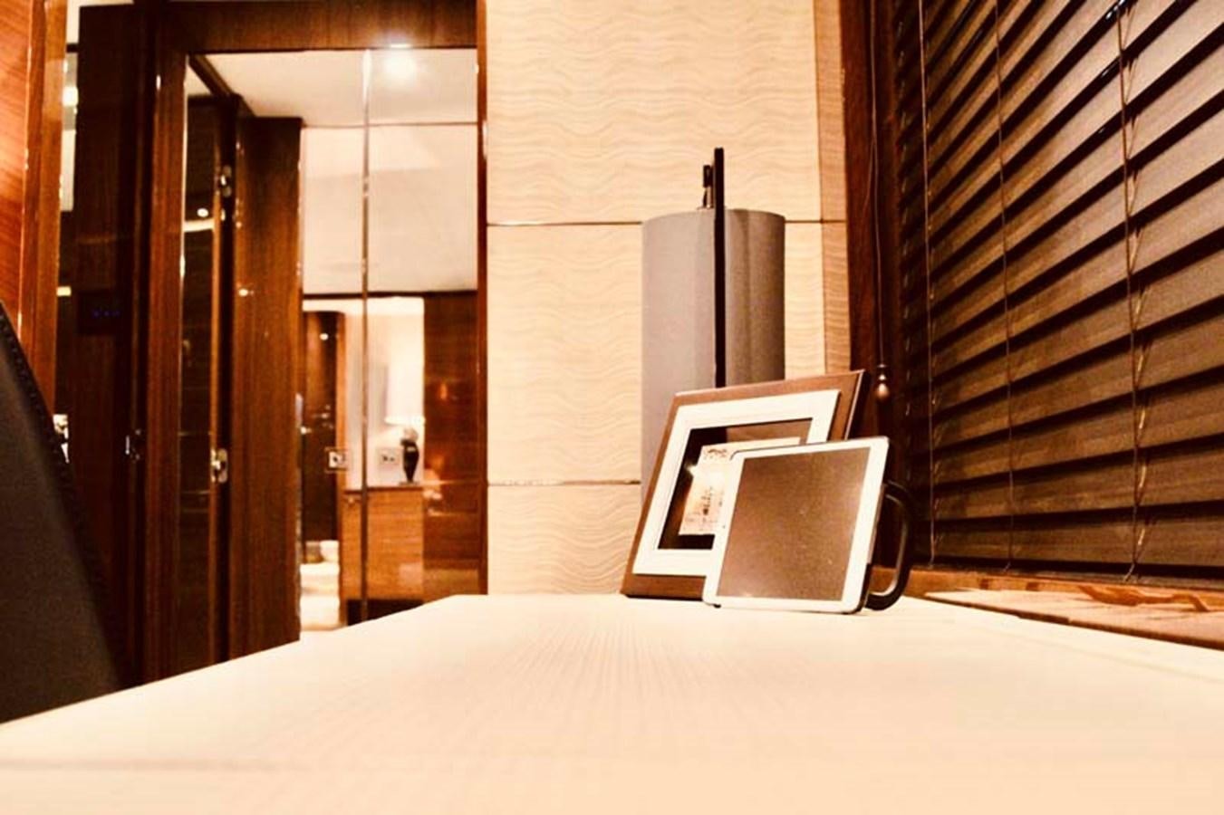 a laptop on a bed aboard AQUA CHAMELEON Yacht for Sale