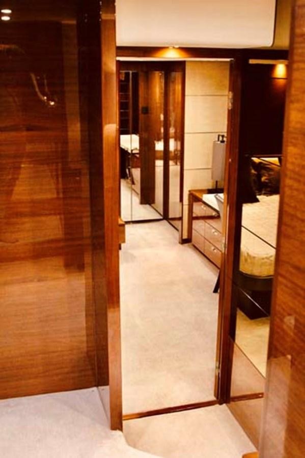 a hallway with a glass door aboard AQUA CHAMELEON Yacht for Sale