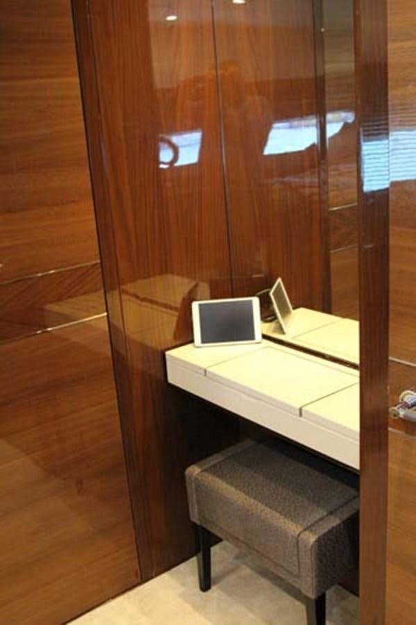 a laptop on a table aboard AQUA CHAMELEON Yacht for Sale