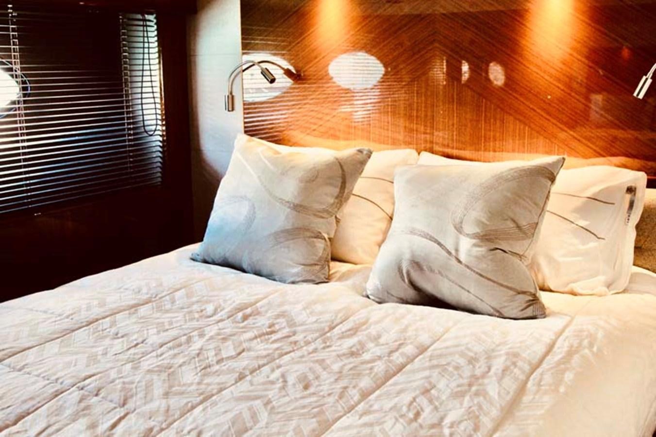 a bed with pillows aboard AQUA CHAMELEON Yacht for Sale