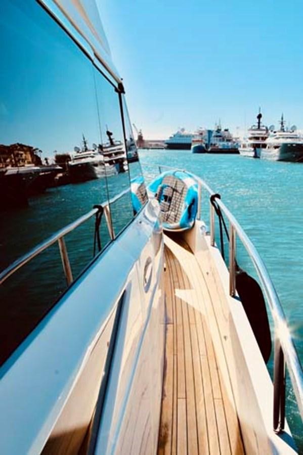 a deck with boats in it aboard AQUA CHAMELEON Yacht for Sale