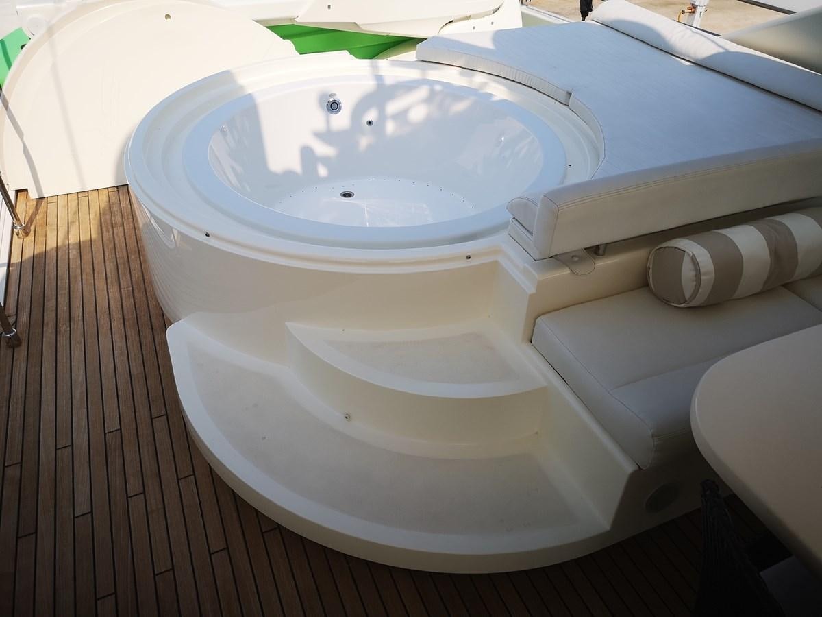 a toilet with a bowl of water aboard RICACHA 2012 FERRETTI 830 @ ACAPULCO Yacht for Sale