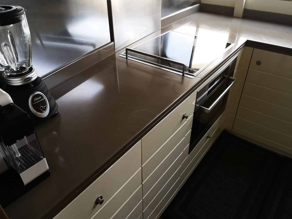 a kitchen with stainless steel appliances aboard RICACHA 2012 FERRETTI 830 @ ACAPULCO Yacht for Sale