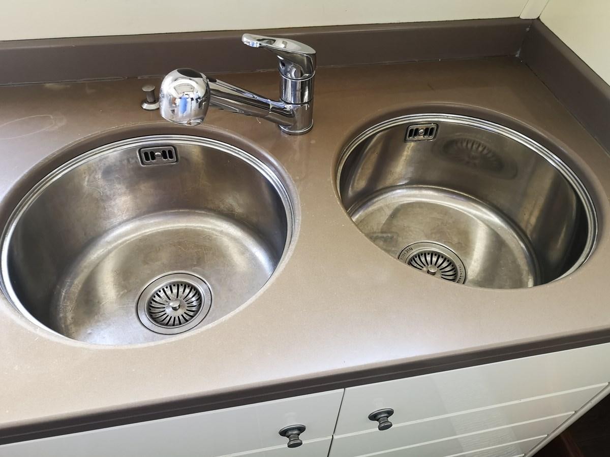 a couple of sinks in a bathroom aboard RICACHA 2012 FERRETTI 830 @ ACAPULCO Yacht for Sale