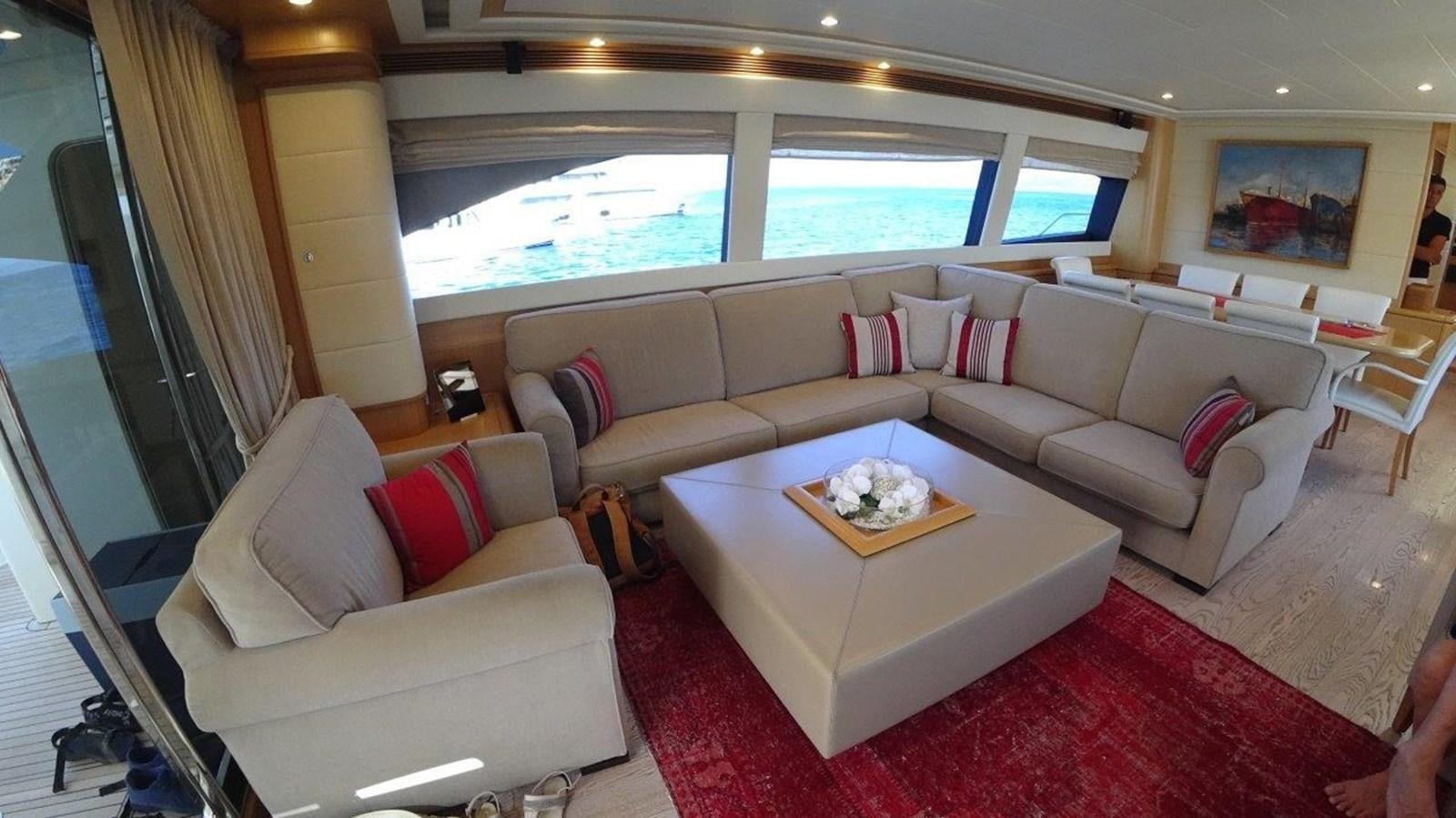 a living room with a red rug aboard CHUPRIANA Yacht for Sale