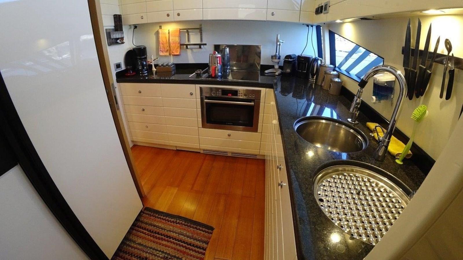 a kitchen with a stainless steel sink aboard CHUPRIANA Yacht for Sale