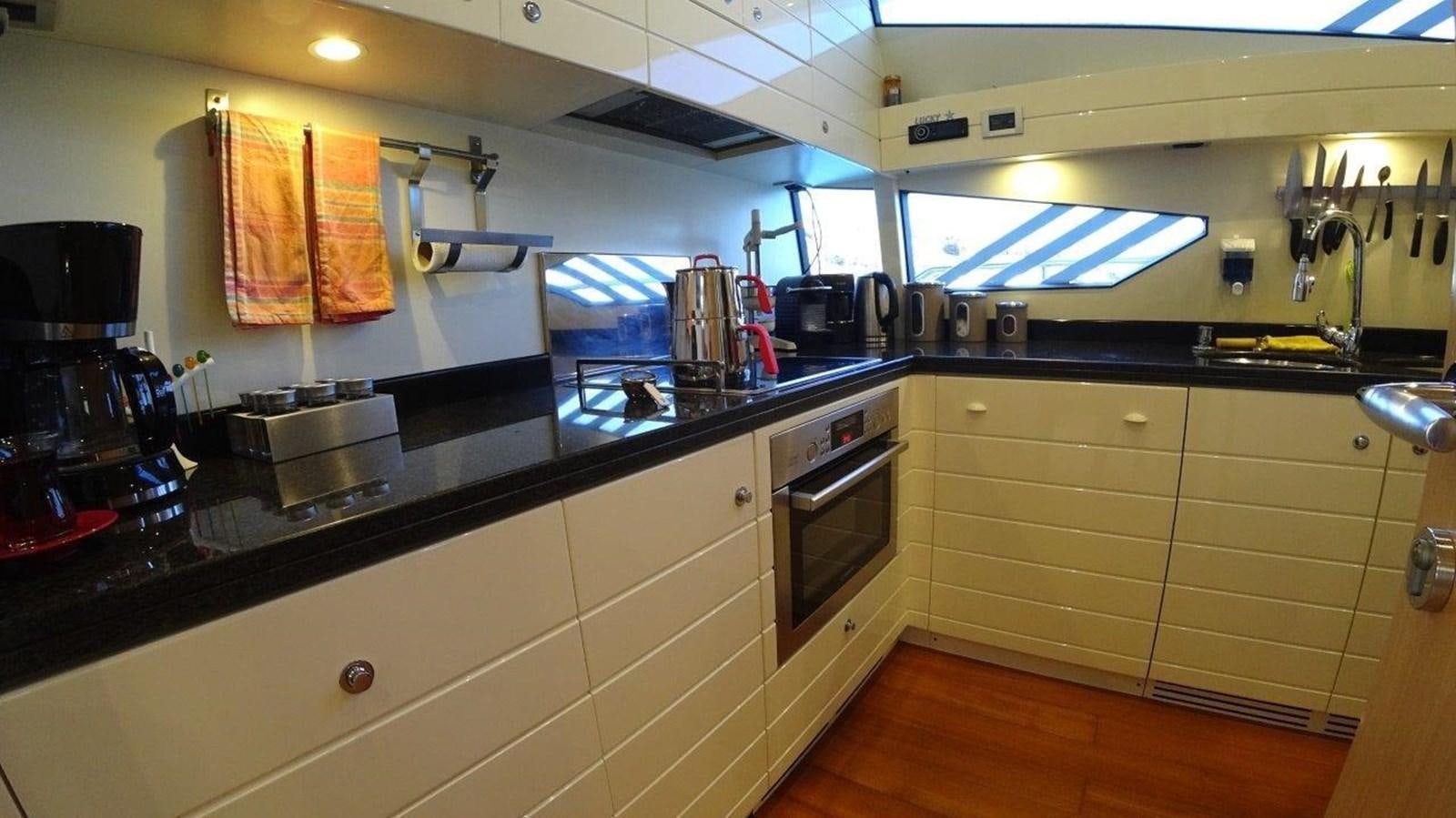 a kitchen with a stove and oven aboard CHUPRIANA Yacht for Sale
