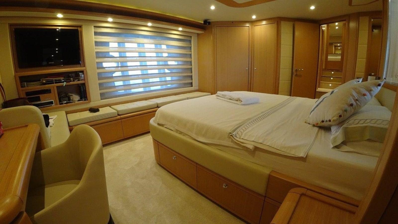 a room with a bed and a television aboard CHUPRIANA Yacht for Sale