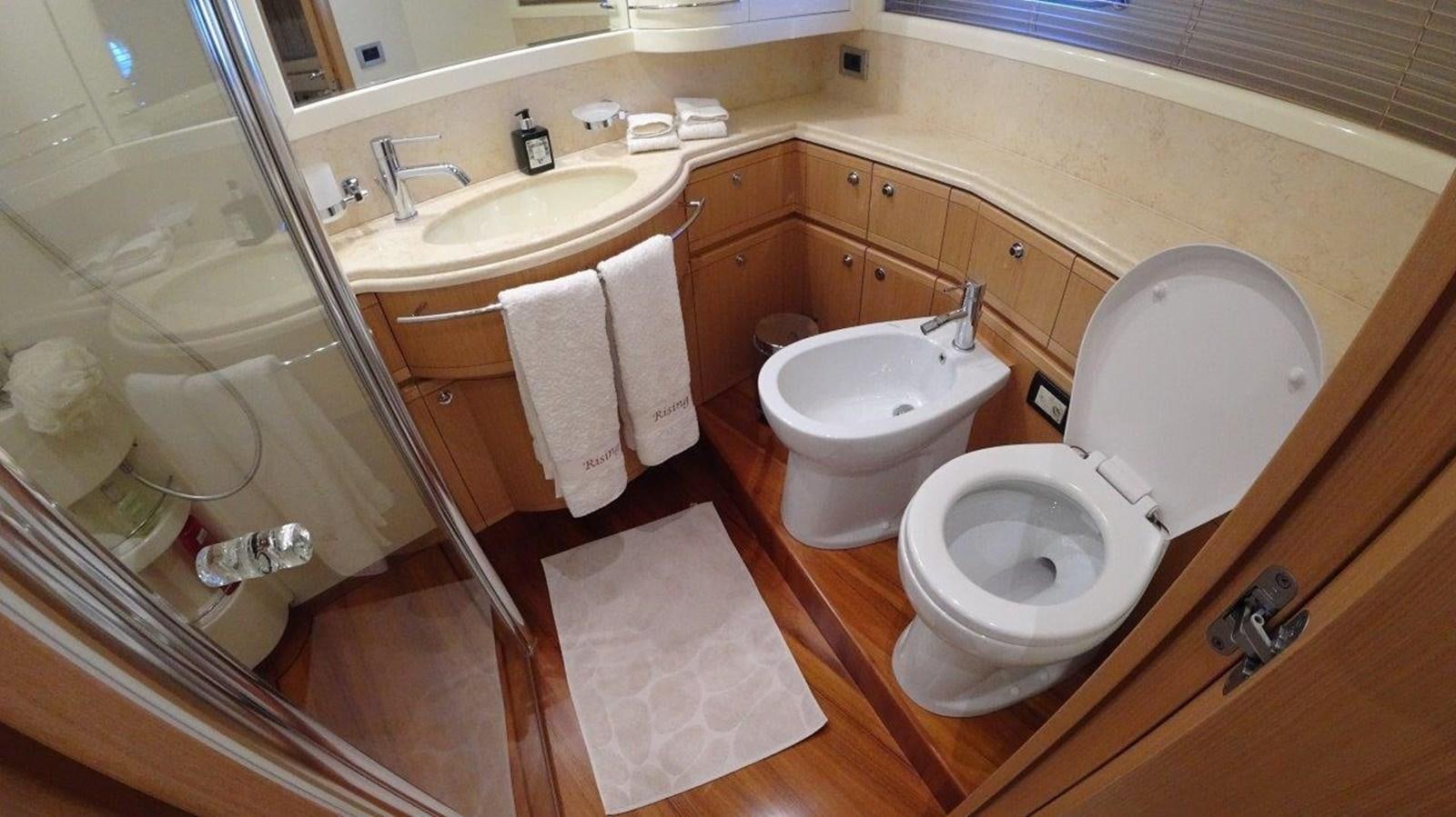 a bathroom with a glass shower aboard CHUPRIANA Yacht for Sale