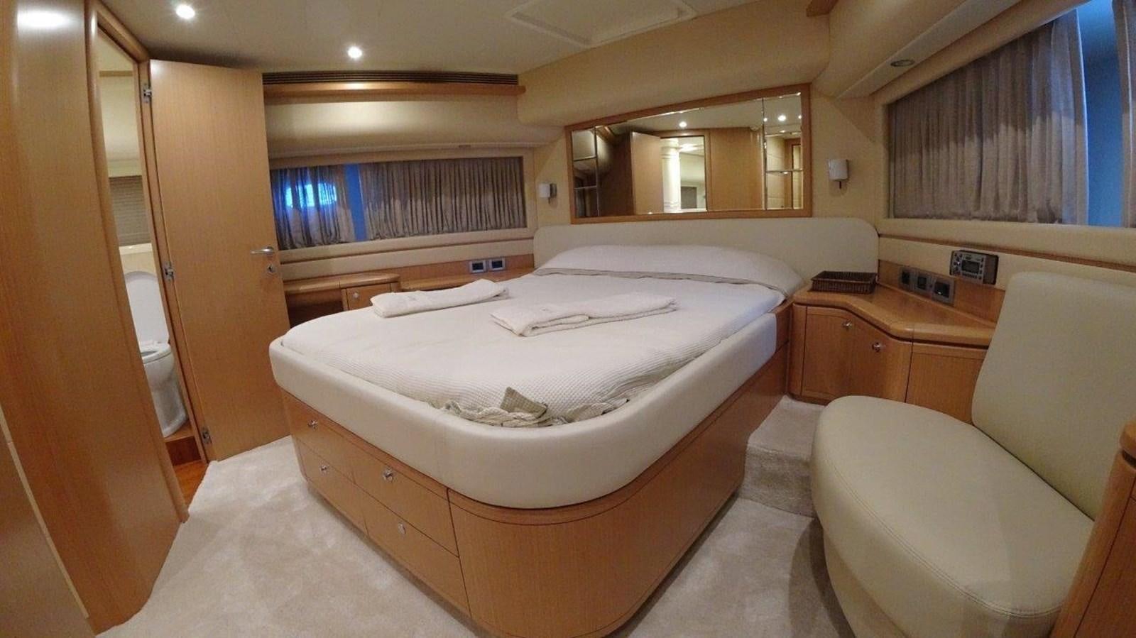 a room with a bed and a chair aboard CHUPRIANA Yacht for Sale