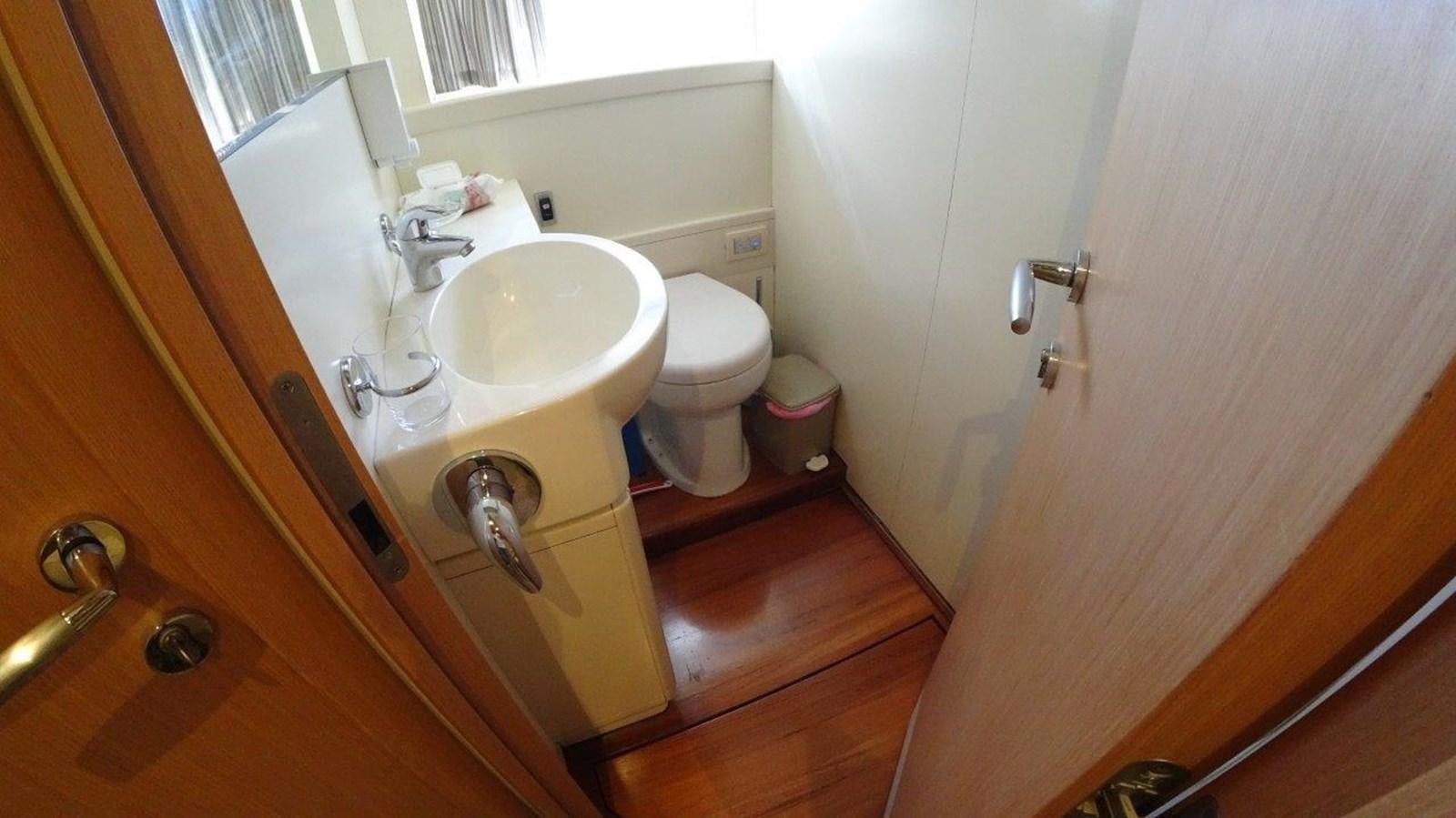 a bathroom with a sink and toilet aboard CHUPRIANA Yacht for Sale