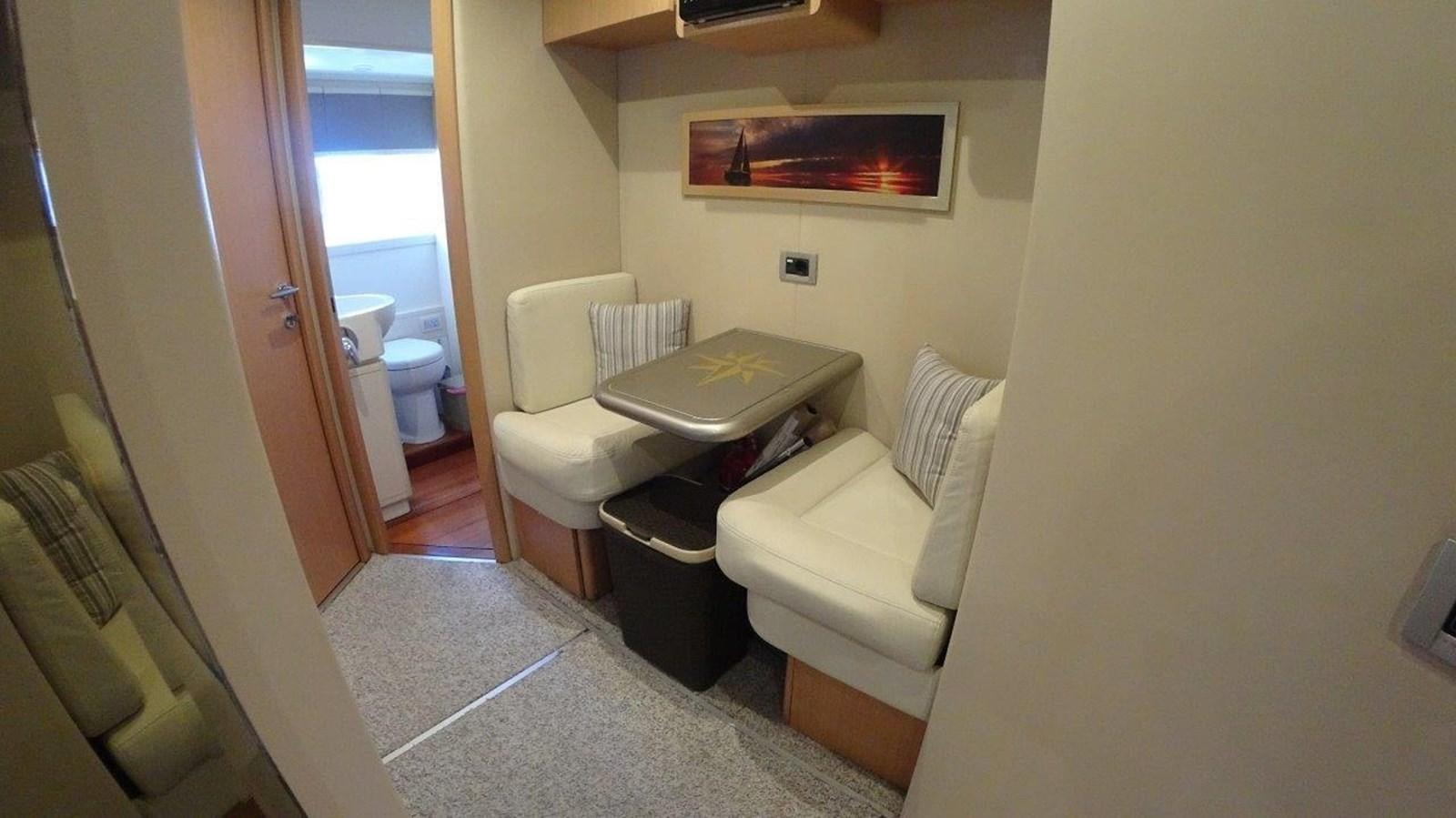 a bathroom with a toilet and a seat aboard CHUPRIANA Yacht for Sale