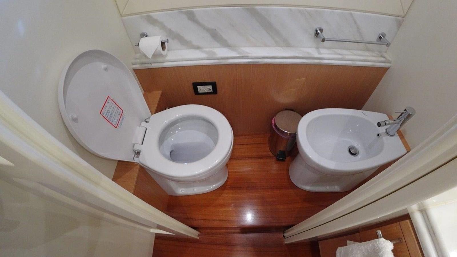 a toilet and sink in a bathroom aboard CHUPRIANA Yacht for Sale