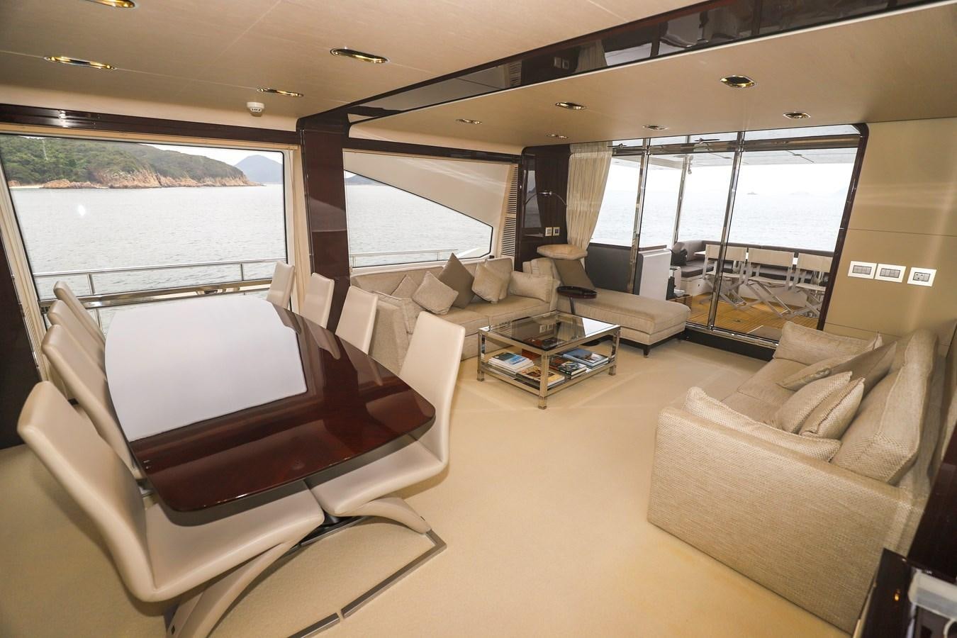 a living room with a large window aboard AZIMUT 80 FLYBRIDGE Yacht for Sale