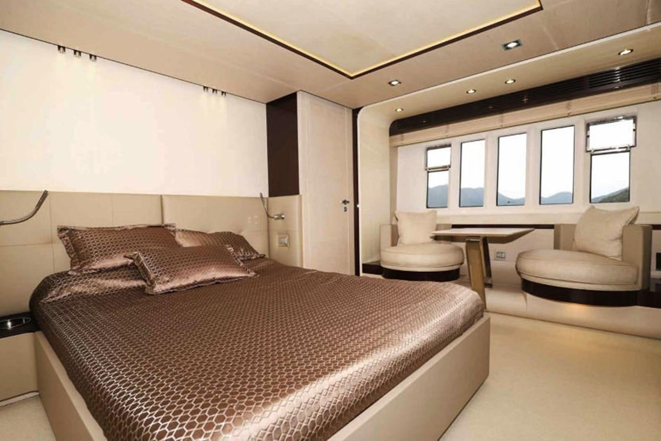 a bed with a black and white bed spread aboard AZIMUT 80 FLYBRIDGE Yacht for Sale