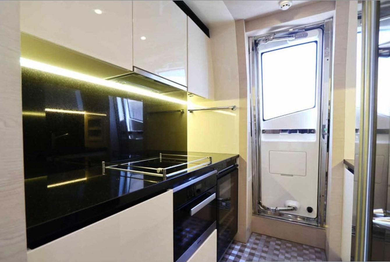 a kitchen with a glass door aboard AZIMUT 80 FLYBRIDGE Yacht for Sale