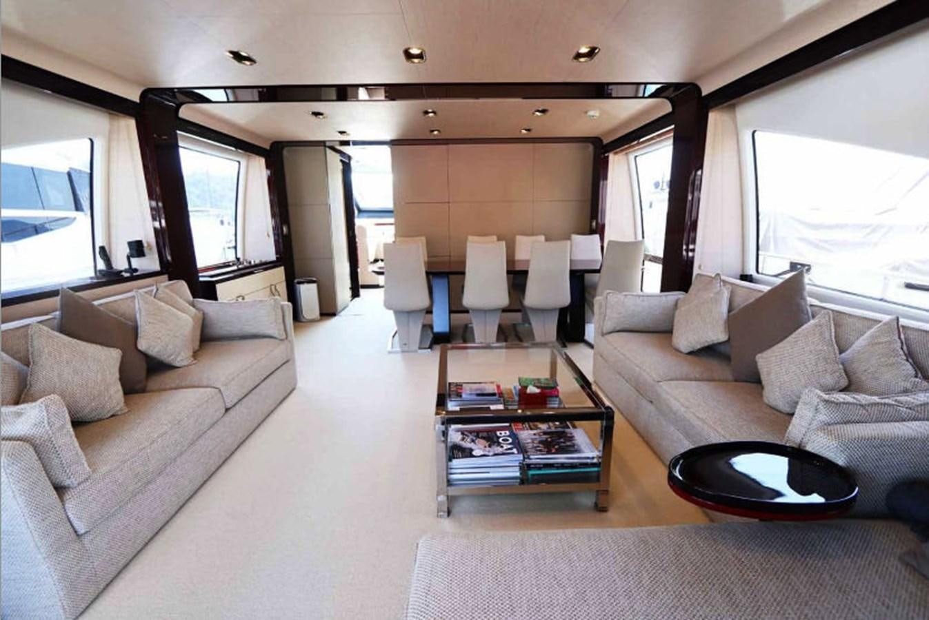 a living room with a large window aboard AZIMUT 80 FLYBRIDGE Yacht for Sale