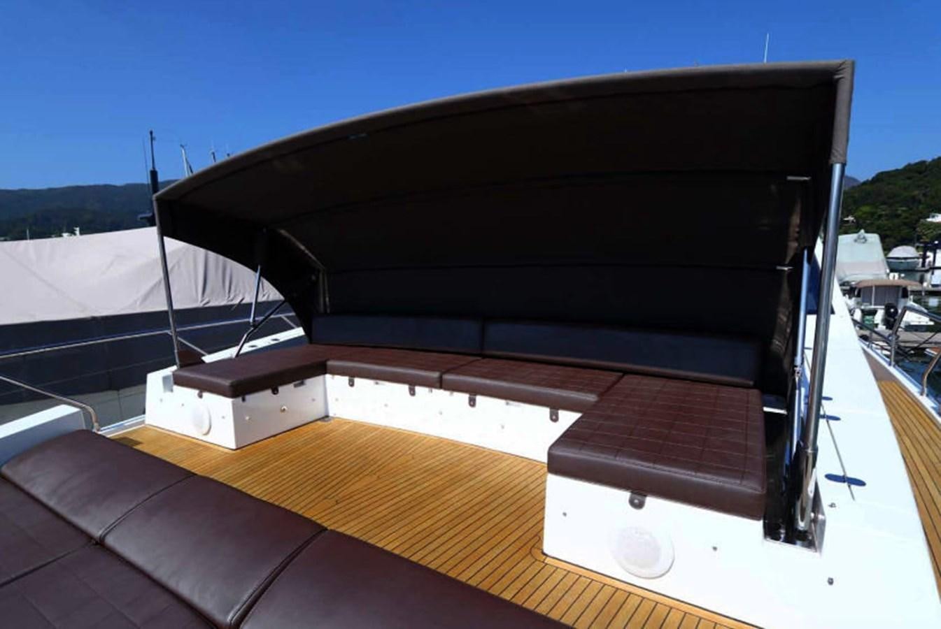 a black rectangular object on a wooden surface aboard AZIMUT 80 FLYBRIDGE Yacht for Sale
