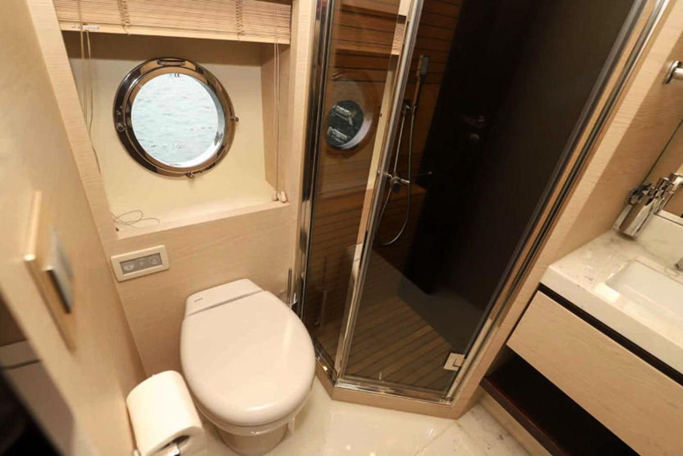 a bathroom with a large mirror aboard AZIMUT 80 FLYBRIDGE Yacht for Sale