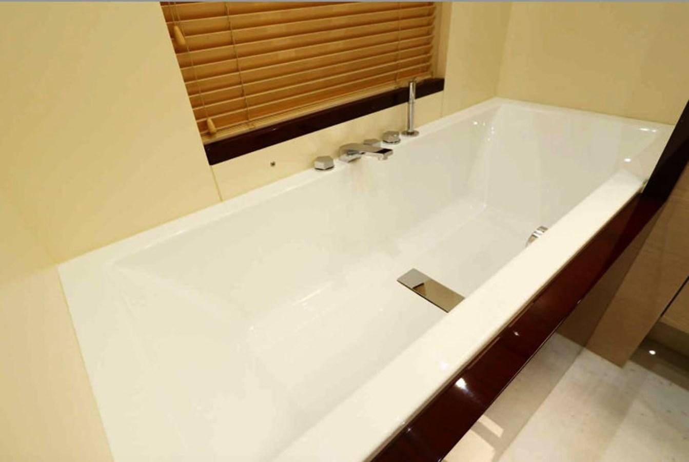 a bathtub with a sink aboard AZIMUT 80 FLYBRIDGE Yacht for Sale