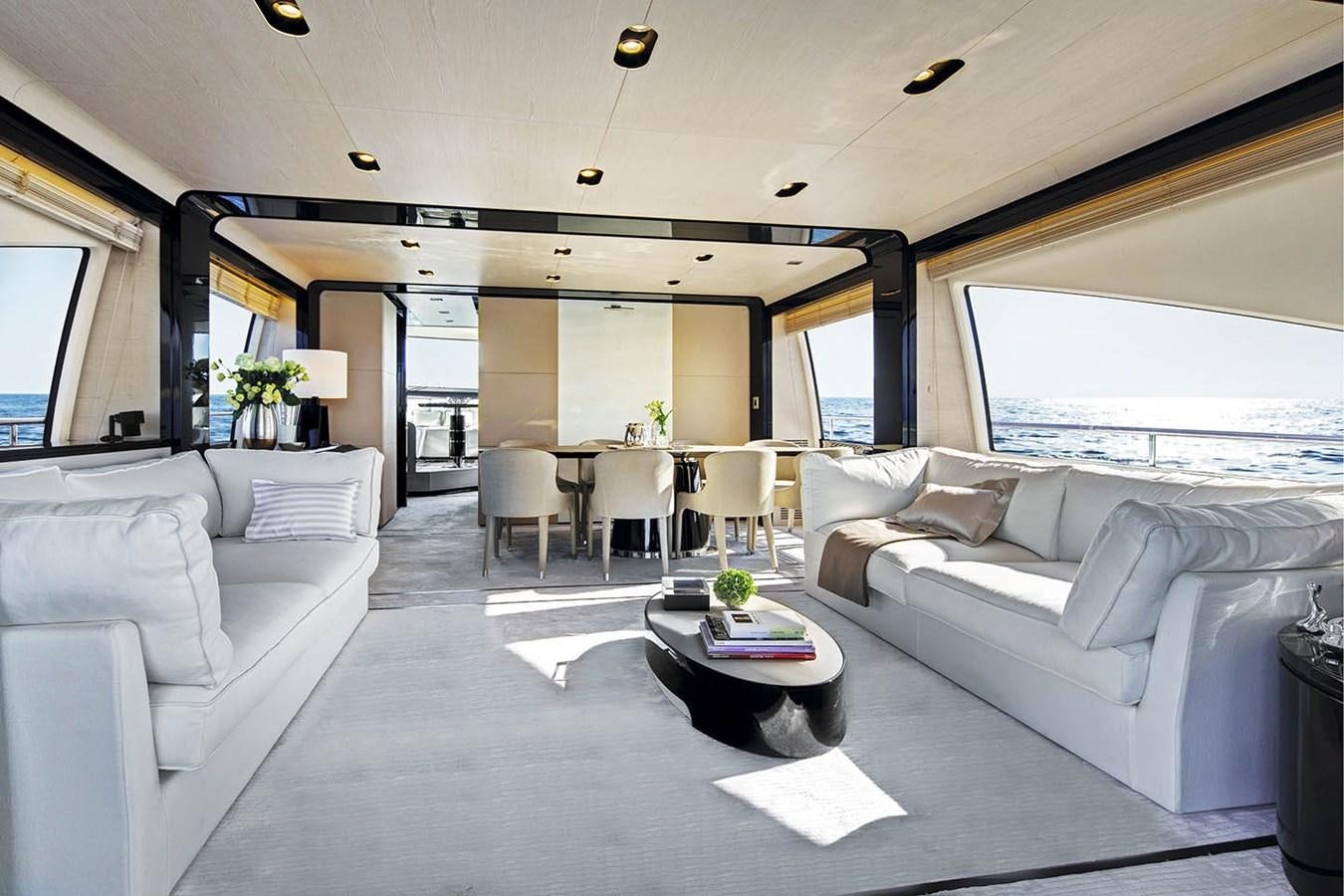 a living room with a couch and a table aboard MEMORIES Yacht for Sale
