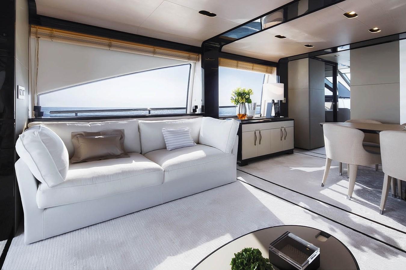 a living room with a couch and a table aboard MEMORIES Yacht for Sale