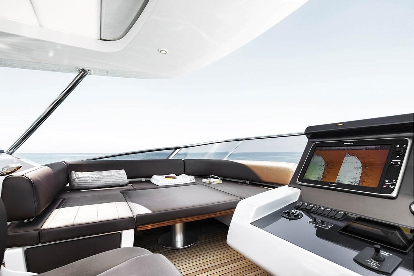 a car with a screen and a monitor on the dashboard aboard MEMORIES Yacht for Sale