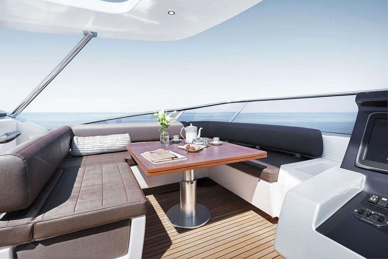a room with a table and a couch aboard MEMORIES Yacht for Sale