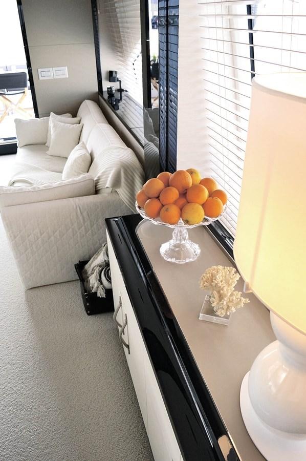 a bedroom with a bed and a table aboard MEMORIES Yacht for Sale