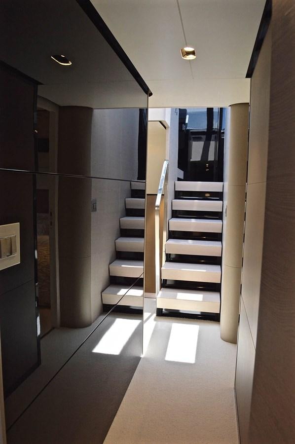 a hallway with a set of stairs aboard MEMORIES Yacht for Sale