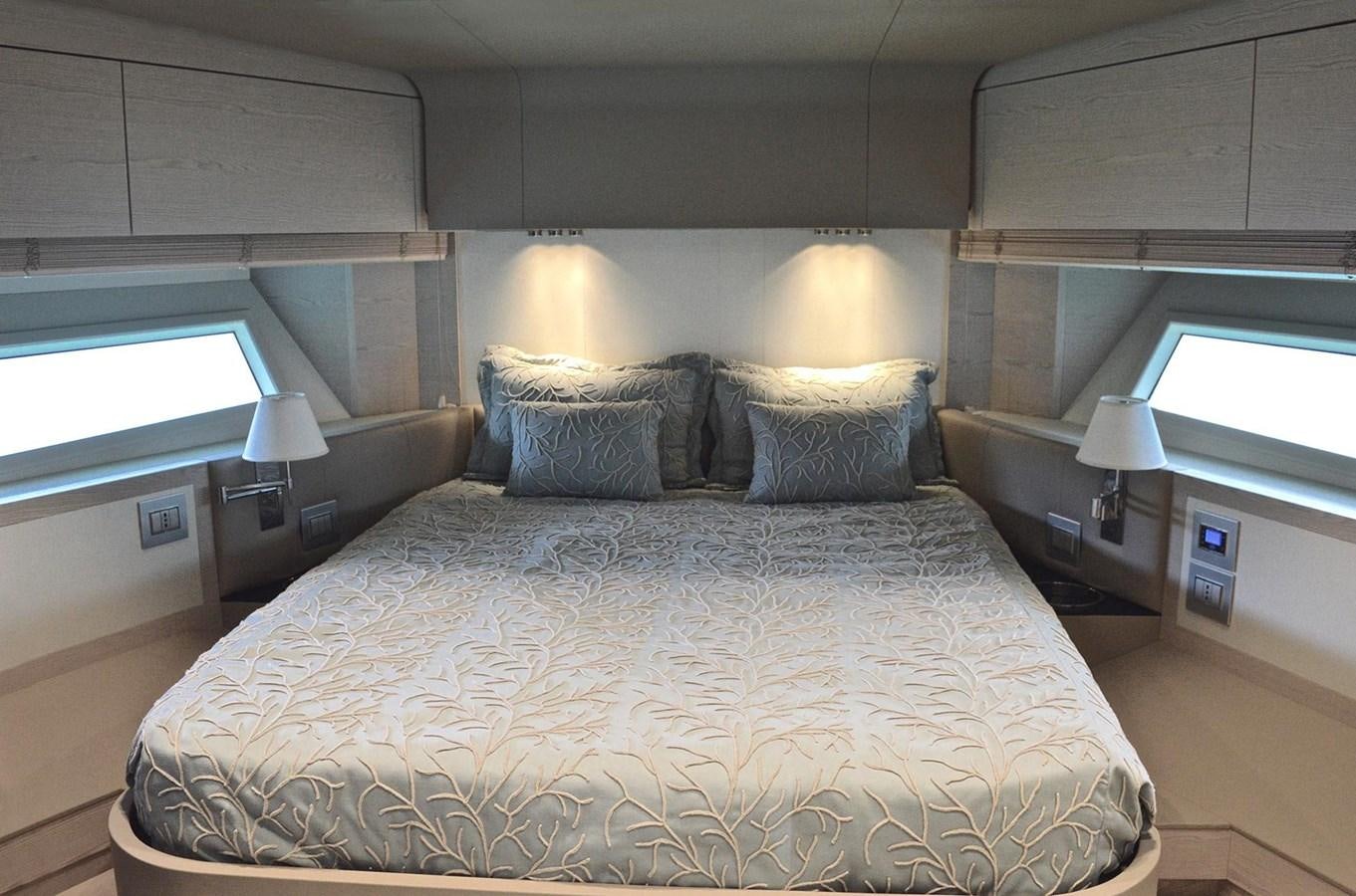 a bed with a white comforter aboard MEMORIES Yacht for Sale