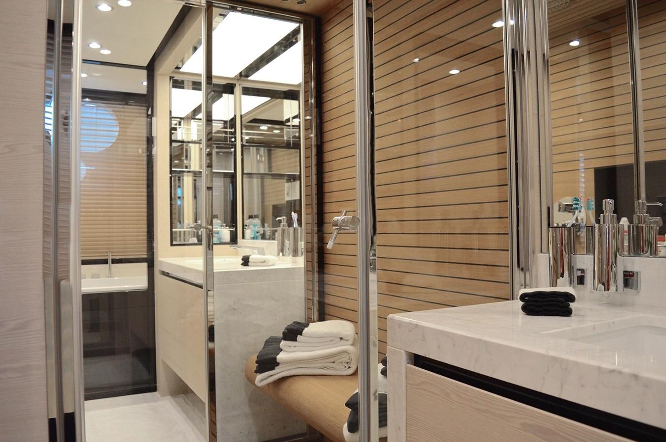 a bathroom with a large mirror aboard MEMORIES Yacht for Sale