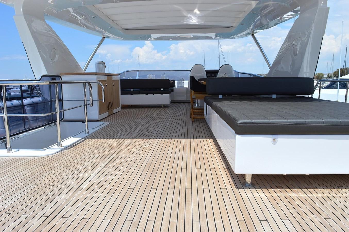 a room with a large deck and a pool aboard MEMORIES Yacht for Sale