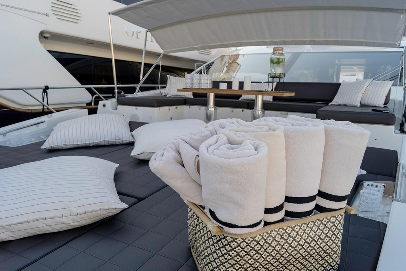a table with folded towels on it aboard MEMORIES Yacht for Sale