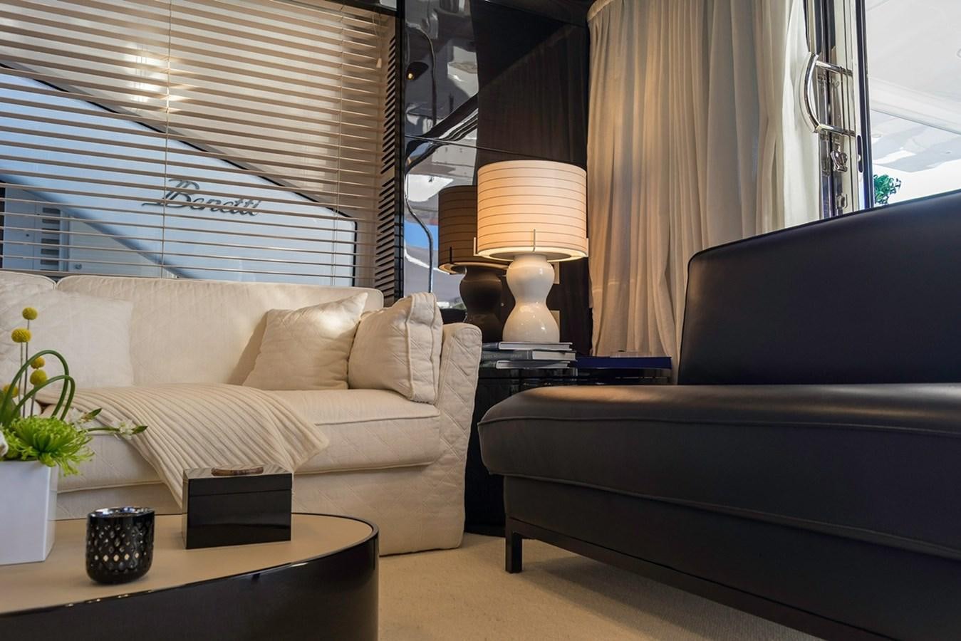 a living room with a couch and a lamp aboard MEMORIES Yacht for Sale