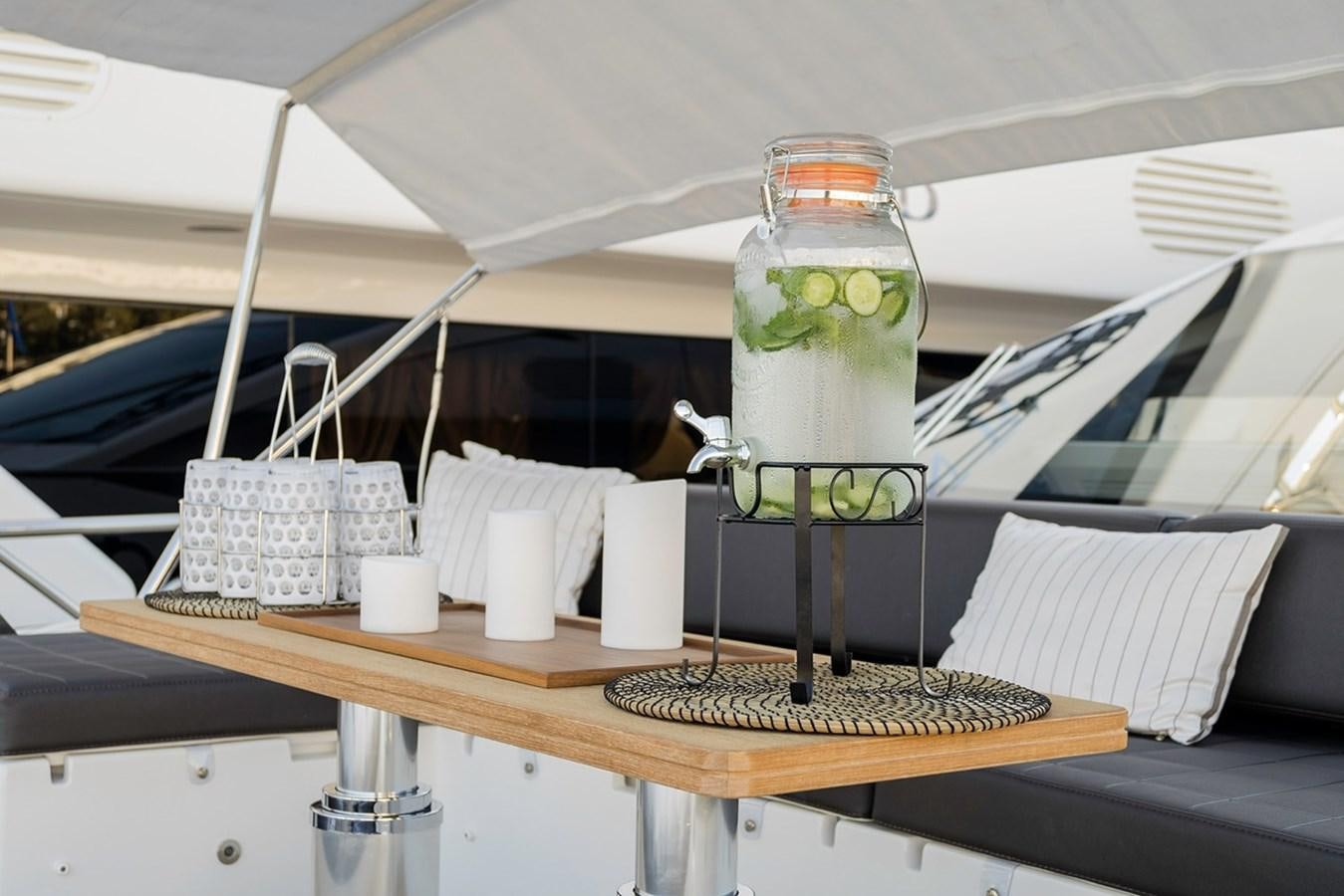 a glass jar with a liquid in it aboard MEMORIES Yacht for Sale