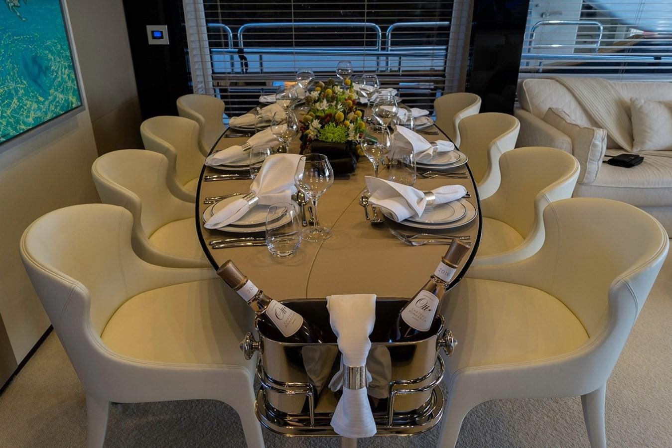 a table set with plates and glasses aboard MEMORIES Yacht for Sale