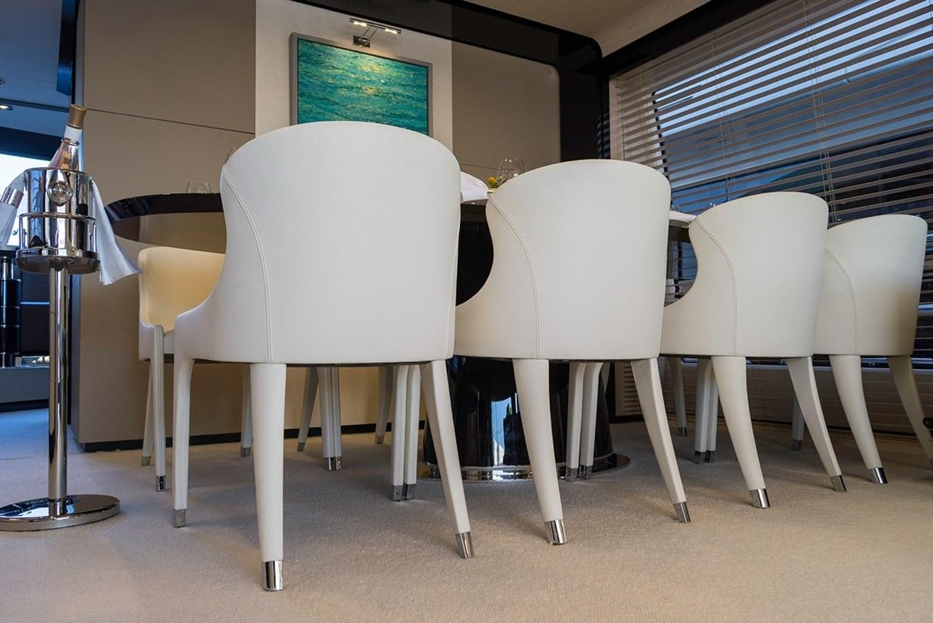 a group of white chairs aboard MEMORIES Yacht for Sale