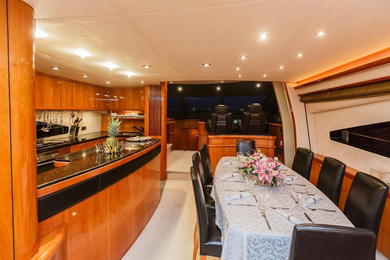 a large kitchen with a table aboard BASYA NICOLI Yacht for Sale
