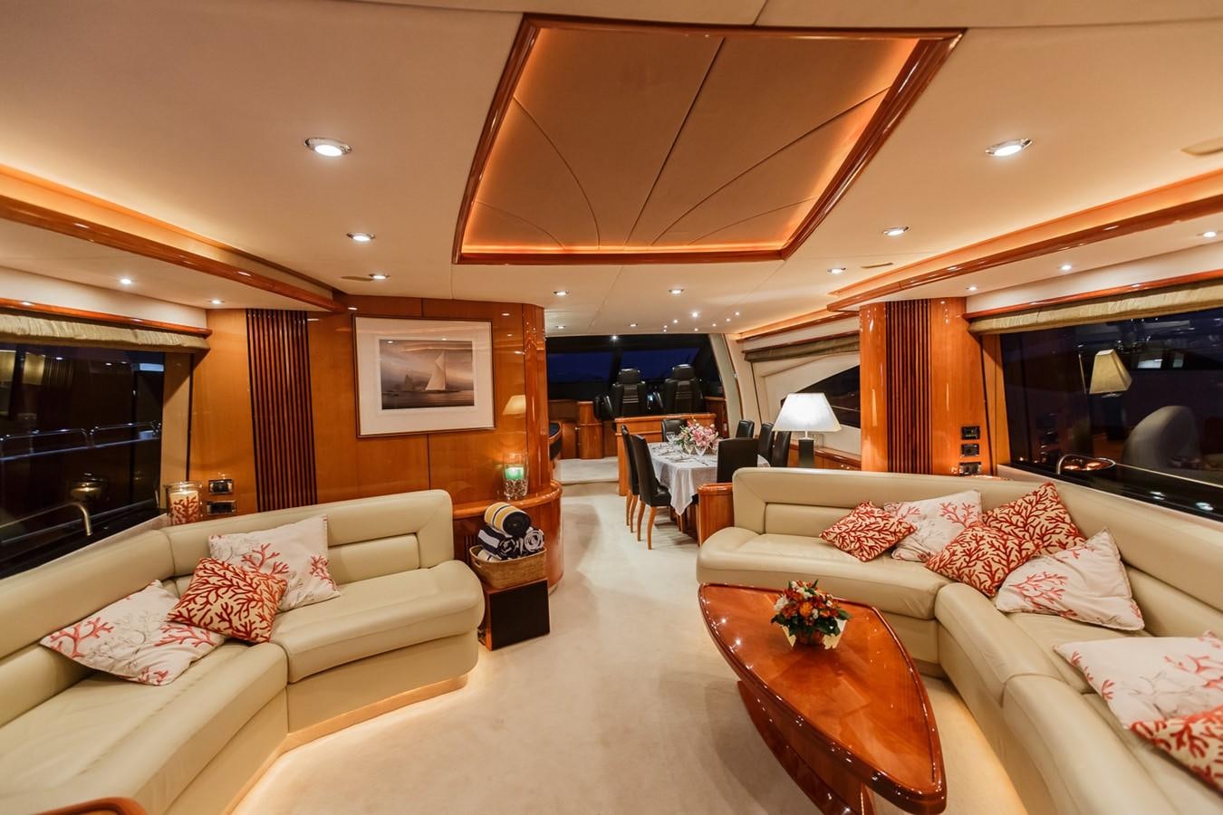 a living room with a couch and a table aboard BASYA NICOLI Yacht for Sale