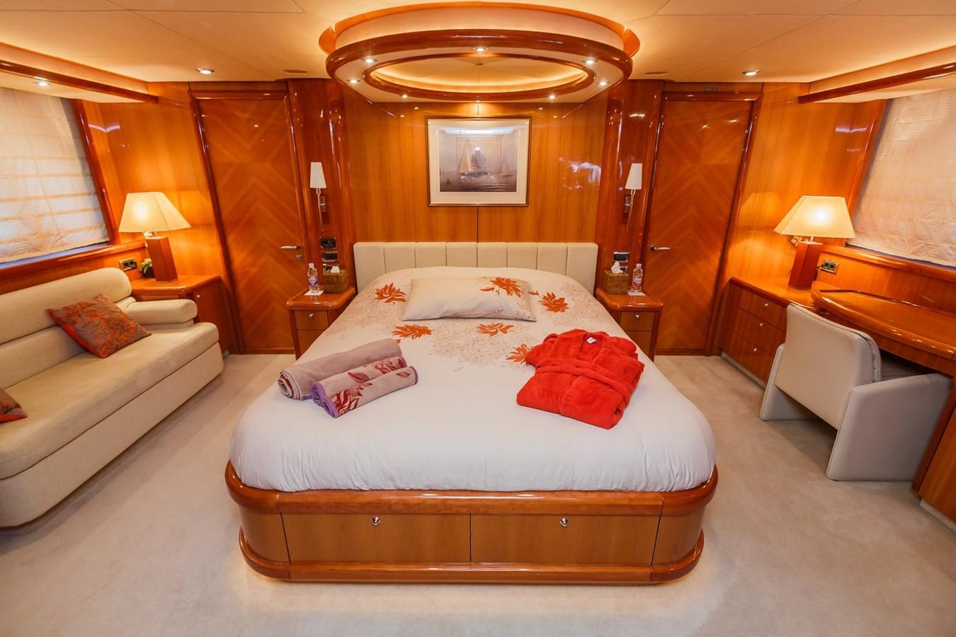 a bedroom with a bed and a couch aboard BASYA NICOLI Yacht for Sale