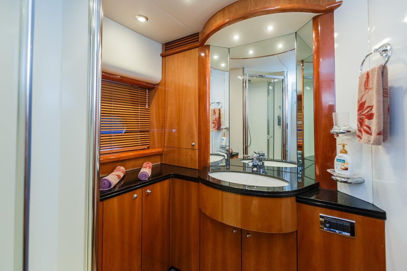 a bathroom with a large mirror aboard BASYA NICOLI Yacht for Sale