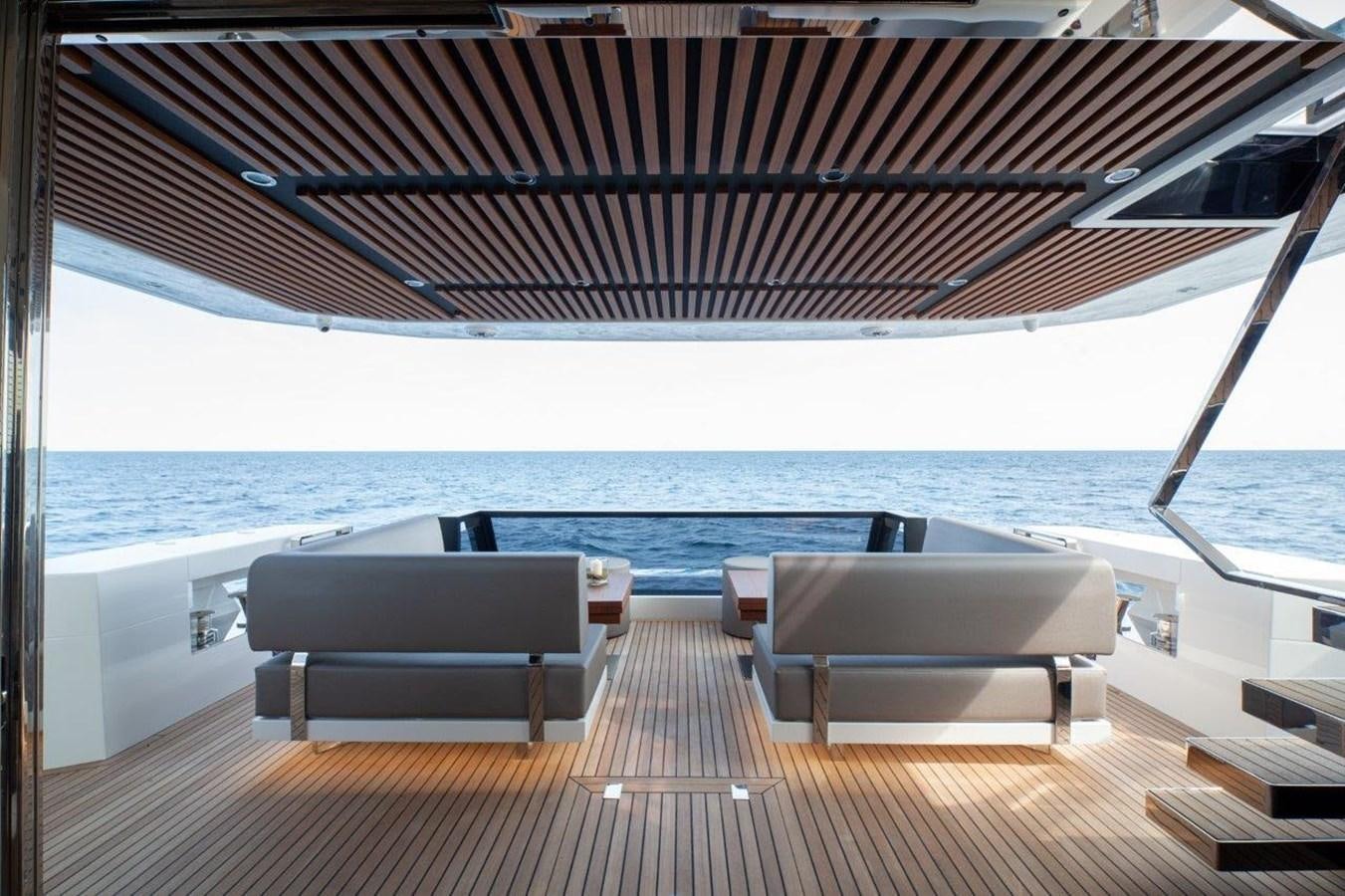 a deck with chairs and a view of the ocean aboard 2021 ASTONDOA AS8 Yacht for Sale