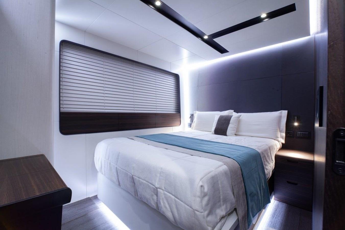 a room with a bed and a window aboard 2021 ASTONDOA AS8 Yacht for Sale
