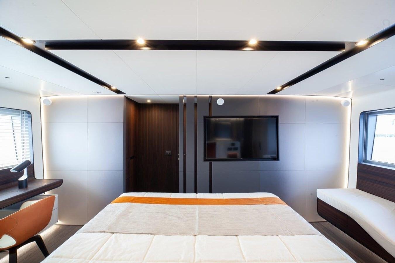 a room with a bed and a television aboard 2021 ASTONDOA AS8 Yacht for Sale