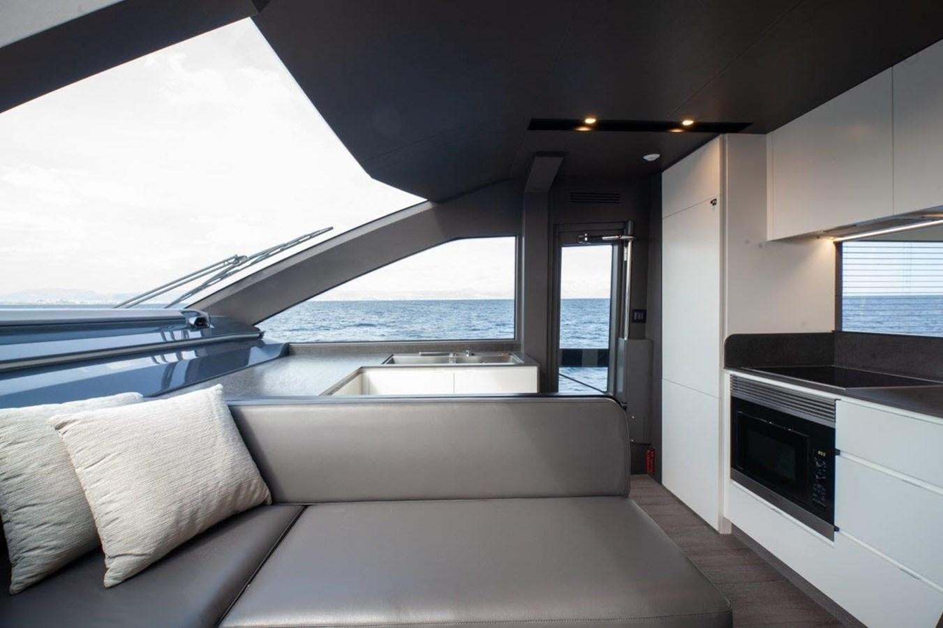 a white couch in a room aboard 2021 ASTONDOA AS8 Yacht for Sale